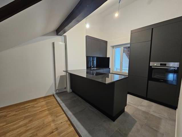 Charmant loft 1.5 pièces avec poutres apparentes à Cortaillod