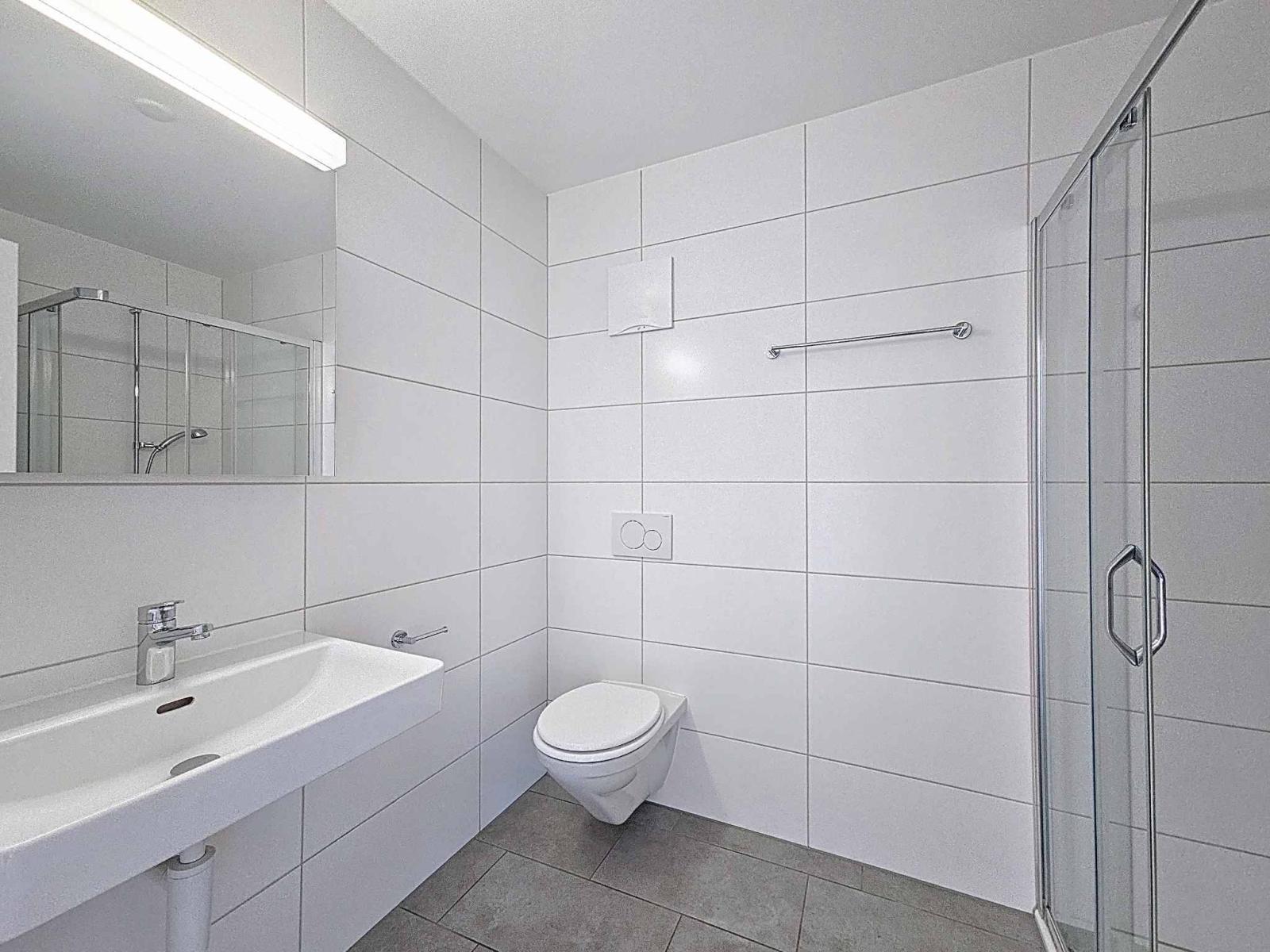 Appartement moderne de 3.5 pièces avec places de parc couvertes
